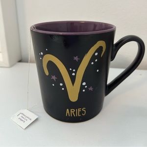 Aries zodiac mug coffee / tea black ceramic w/ purp & gold design.